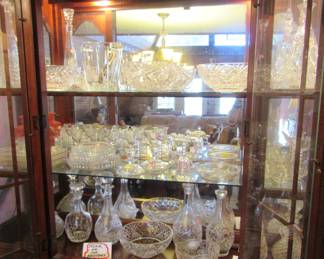 Numerous old cutglass and pressed glass decanters and cut and pressed lead crystal bowls.