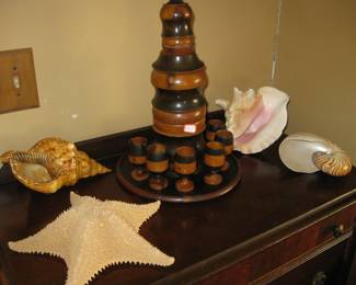 Wooden decanter with 6 wooden glasses, also numerous sea items.