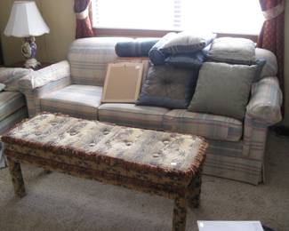 Sofa and lots of decorative pillows.
