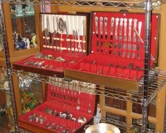 Silver plated items to include flatware, pitchers and servers.