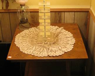 Very nice early oak parlor table, and deco lamps.