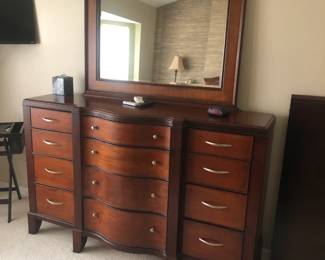 Dresser 66" X 42" inch high plus Mirror & to the right is the Dining Table Leaf 