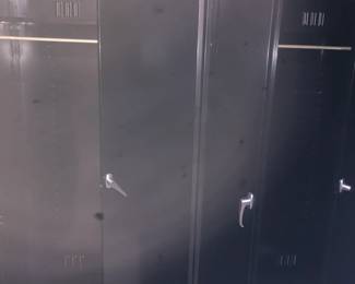 2 Metal Cabinets showing Clothes Hanging Rods 