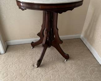 Antique Oval Marble Top Sid Table on Casters (27"W x 20"D x 30"H)