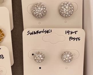 Two pairs of Swarovski rhinestone earrings, one featuring 14 karat posts