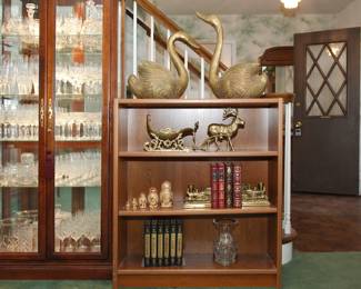 One of two Made in Denmark three shelf bookcases shown with FAB 1980's solid brass decor including Massive Swan Planters and a Reindeer Pulling a Sleigh