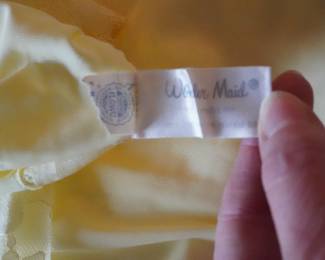 Tag detail of Wonder Maid vintage lace and satin camisoles or slips in nude and yellow
