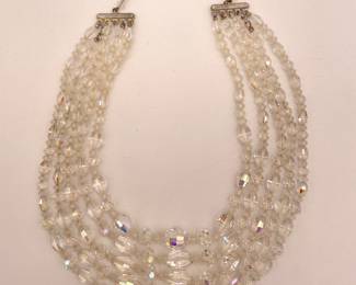 Multi layered clear beaded necklace with a silver clasp fishhook clasp