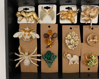 Wonderful collection of whimsical costume jewelry  animal insect and nature pins or brooches, including a Monet Jaguar pin, a Trifari Butterfly Wing Brooch, a Monet Acorn and Leaf pin, a Crown Trifari gold rose