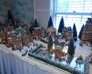 Another view of display of the extensive collection of Department 56 Heritage Village Collection Christmas Decorations