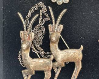 A pair of silver Antelope pins/brooches