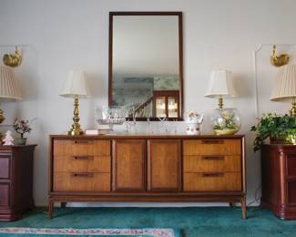Mid century modern walnut sideboard or credenza shown with a large mid century modern walnut mirror, and a pair of brass lamps.  Pair of contemporary end tables or night stands shown with a pair of Stiffel brass lamps