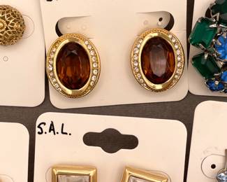 A pair a Christian Dior gold vintage earrings, clear rhinestones and orange brown topaz faceted glass stone center