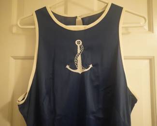 Bodice detail of Vanity Fair vintage navy blue nightgown with white piping and a white embroidered anchor