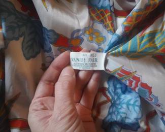 Tag detail of vintage Vanity Fair nightgown in a tropical floral pattern and red piping with a matching robe, Size Med