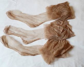 Three vintage nylon hose with seams with rhinestones on the back of the ankles......