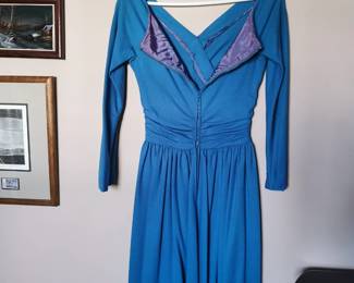 Zip back detail of vintage blue faux wrap skater dress with long sleeves and a sip back, fully lined, tags cut out