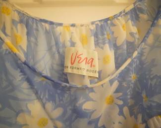 Tag detail of short babydoll version of blue vintage Vera nightgown with white daisies and ruffled collar, matches previous robe and nightgown