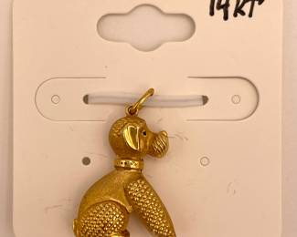 A 14KT yellow gold poodle dog charm