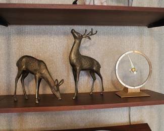 Pair of solid brass figures of a doe and buck, along with a Jefferson Golden Hour Mystery Clock