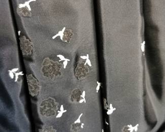 Detail of velvet pattern on  amazing home sewn (!) vintage gathered skirt in a black taffeta with tiny black velvet roses with white stems pattern