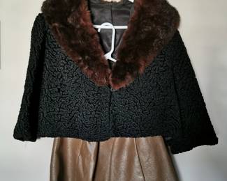 Gorgeous vintage 1960s, 1970s glam outfit featuring a brown leather skirt and a black cropped jacket with a wide fur collar