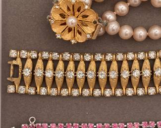 Detail of collection of costume jewelry necklaces and bracelets