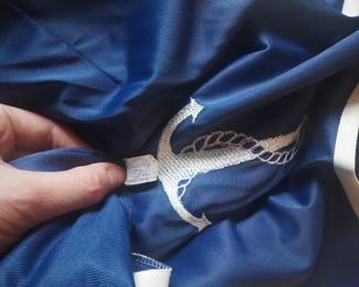 Tag detail of Vanity Fair vintage navy blue nightgown with white piping and a white embroidered anchor
