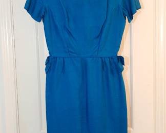 Gorgeous cerulean blue short sleeved vintage dress with side seam bow details at the waist