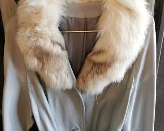 Front detail of unique vintage gray or taupe belted leather jacket with a lovely sand color fur collar
