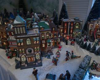 Another lit up view of  display of the extensive collection of Department 56 Heritage Village Collection Christmas Decorations