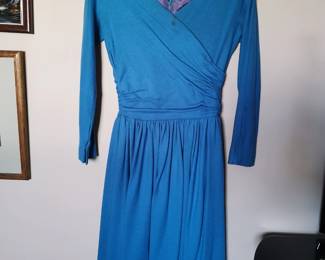 Vintage blue faux wrap skater dress with long sleeves and a sip back, fully lined, tags cut out