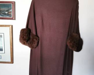 Stunning 1960s Sandi Monica California brown swing dress with a zip back, a funnel neck, and fur sleeve cuffs, Size 10