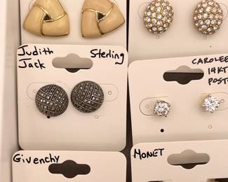 Detail of costume jewelry earrings featuring Monet, Swarovski, Judith Jack, Carolee, and Givenchy