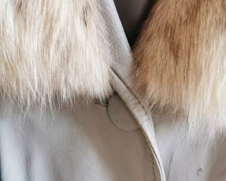 Collar detail of unique vintage gray or taupe belted leather jacket with a lovely sand color fur collar