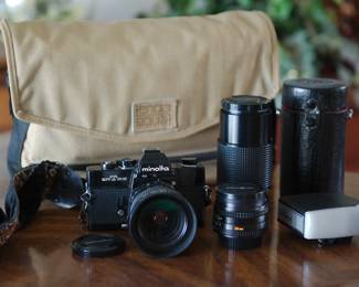 Vintage Minolta SR T 202 camera with accessories, in a vintage canvas camera bag