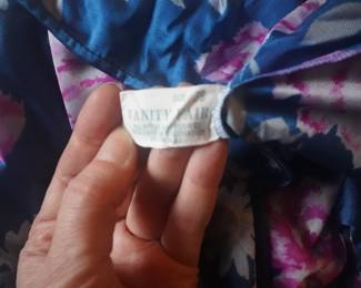 Tag detail of vintage Vanity Fair blue and pink floral nightgown with gathers at the bodice and 3/4 sleeves, Size 38
