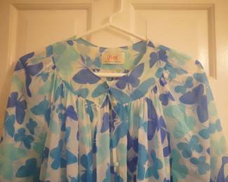 Bodice detail of vintage Vera short nightgown with blue butterflies, long sleeves, and a button collar