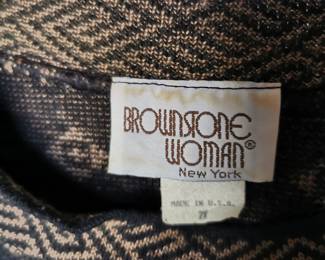 Tag detail of Brownstone Woman New York, vintage sweater and skirt set featuring light brown medallion designs on black sweater, Size 28