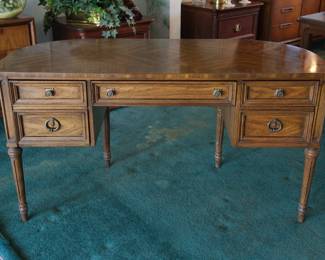 The front of the lovely desk or dressing table that can be free-standing as it is finished on all sides, with the back elegantly curved in a demilune form.