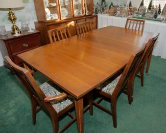 Gorgeous mid century modern walnut dining table with three (3) leaves and eight (8) chairs.  Table top is in excellent condition!