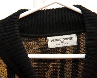 Tag detail of lovely vintage Alfred Dunner oversized seater with a black base and gold metallic threads woven in for pattern, wide necked ribbed collar and blocked patterns including black and gold stripes, black with gold polkadots, and gold filigree on a black base, size 3X