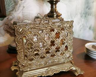 1980s brass decorator's items including a brass letter holder or napkin holder