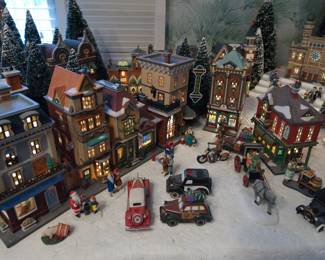 Village and car detail of display of the extensive collection of Department 56 Heritage Village Collection Christmas Decorations