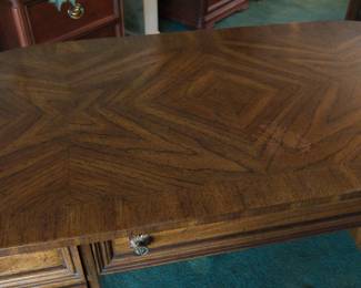 The top of the ;ovely desk or dressing table that can be free-standing as it is finished on all sides, with the back elegantly curved in a demilune form.