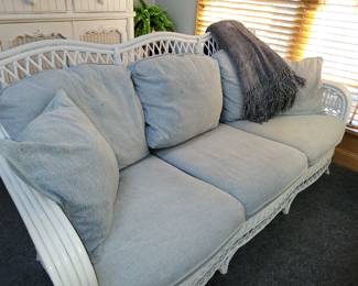 2 white wicker sofas & cocktail table