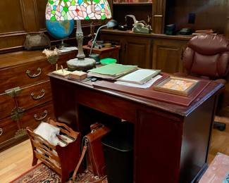 Tiffany style lamps, desks antique carpets and antique books.