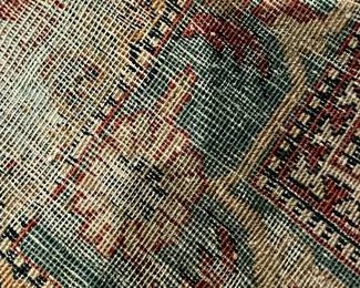 Antique rug in library