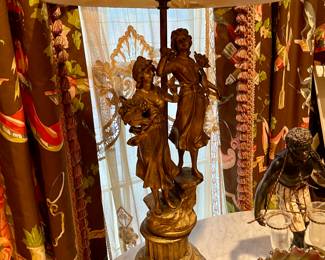 Figural antique lamps one of a pair