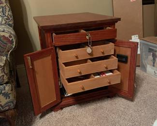 Handmade cigar humidor with locking cabinet and top drawer.